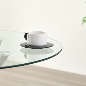 New York Circle Glass Dining Table with starburst black legs